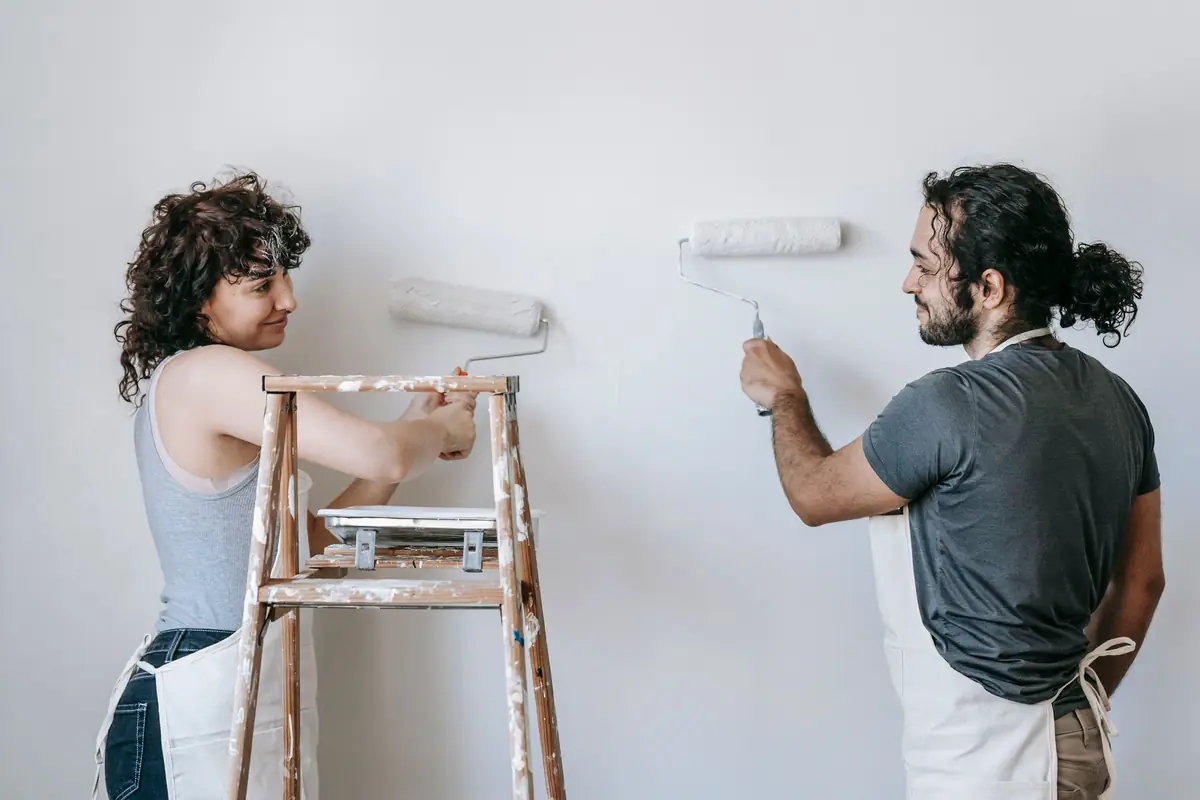 People painting a wall together — painting help in Springfield